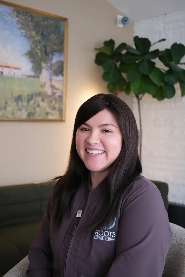 Viv, Patient Care Coordinator at Roots Dental Studio in Oak Lawn, IL.